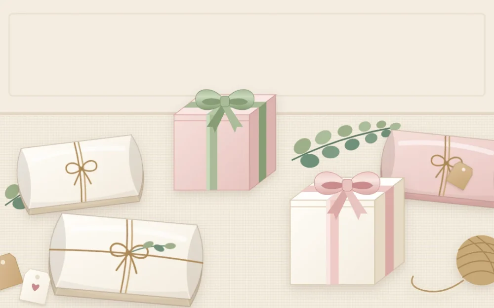 Small ivory and blush favor boxes on a table: three pillow-shaped boxes tied with twine and two cubes with ribbon bows