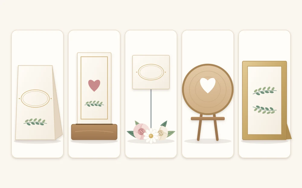 Five table marker styles as tiles: a folded tent card, a card in a slotted wooden block, a card on a wire pick, a painted wooden round and a framed card