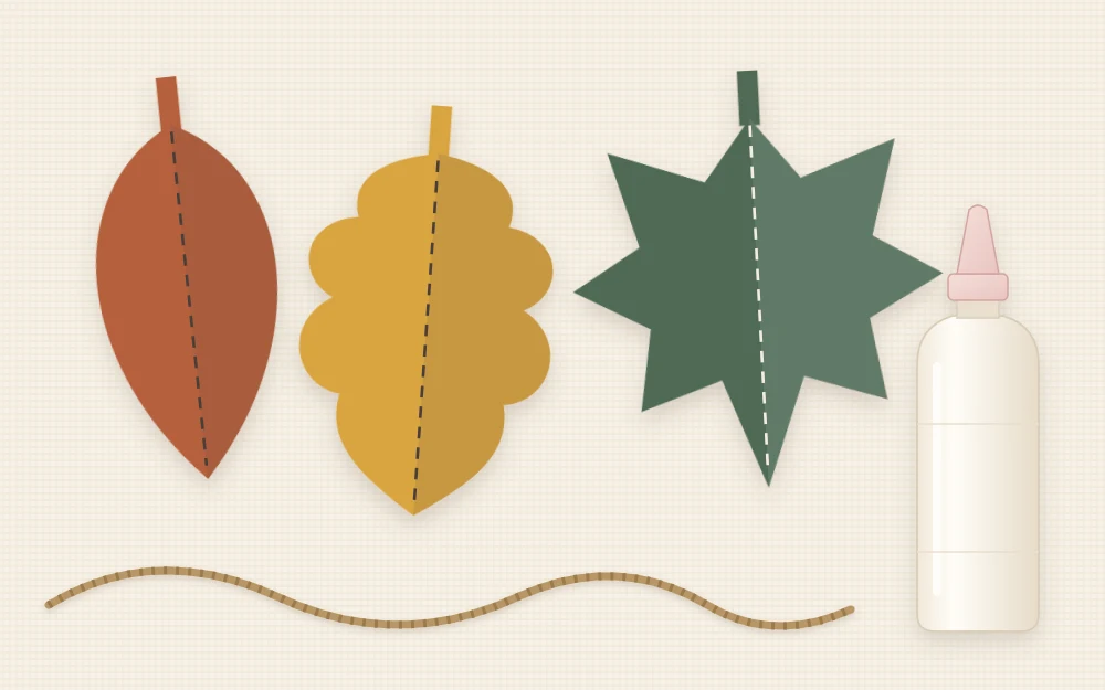Three paper leaf shapes with scored center veins lying beside a length of twine and a glue bottle