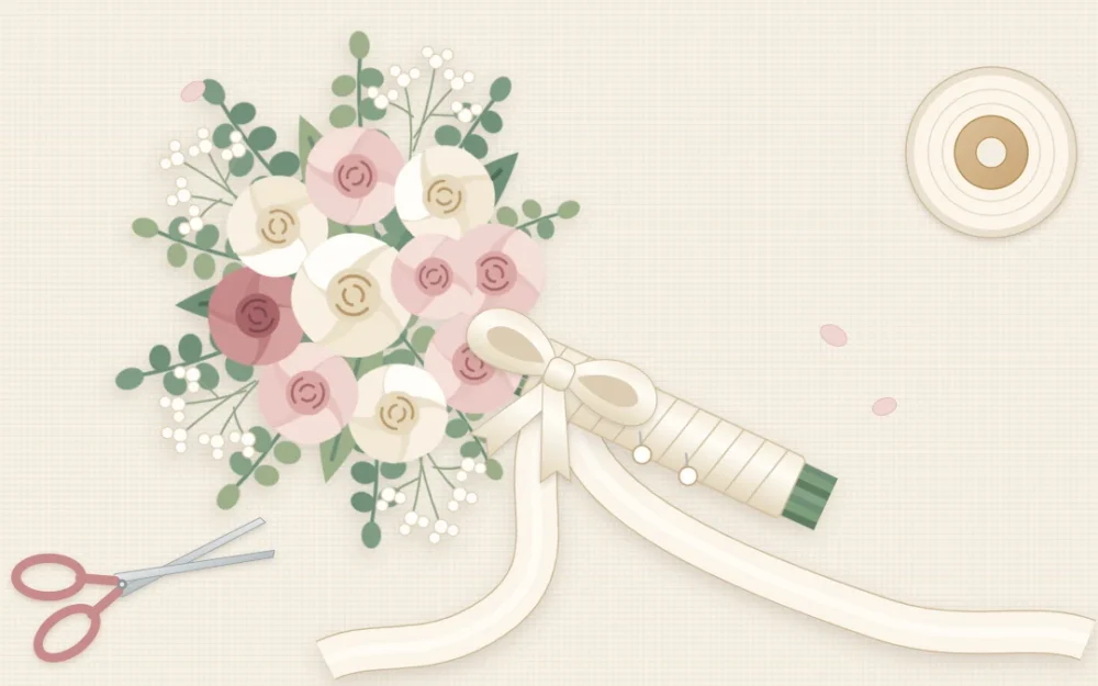 A round bouquet of blush and ivory flowers with eucalyptus, its stems wrapped in ivory satin ribbon with long trailing tails