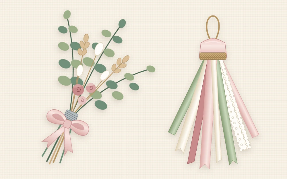 A small bundle of eucalyptus and dried flowers bound with wire and finished with a ribbon, lying next to a tassel made of mixed ribbon strips